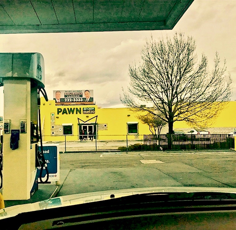 'Lawyer billboard above pawnbroker COTIN.org